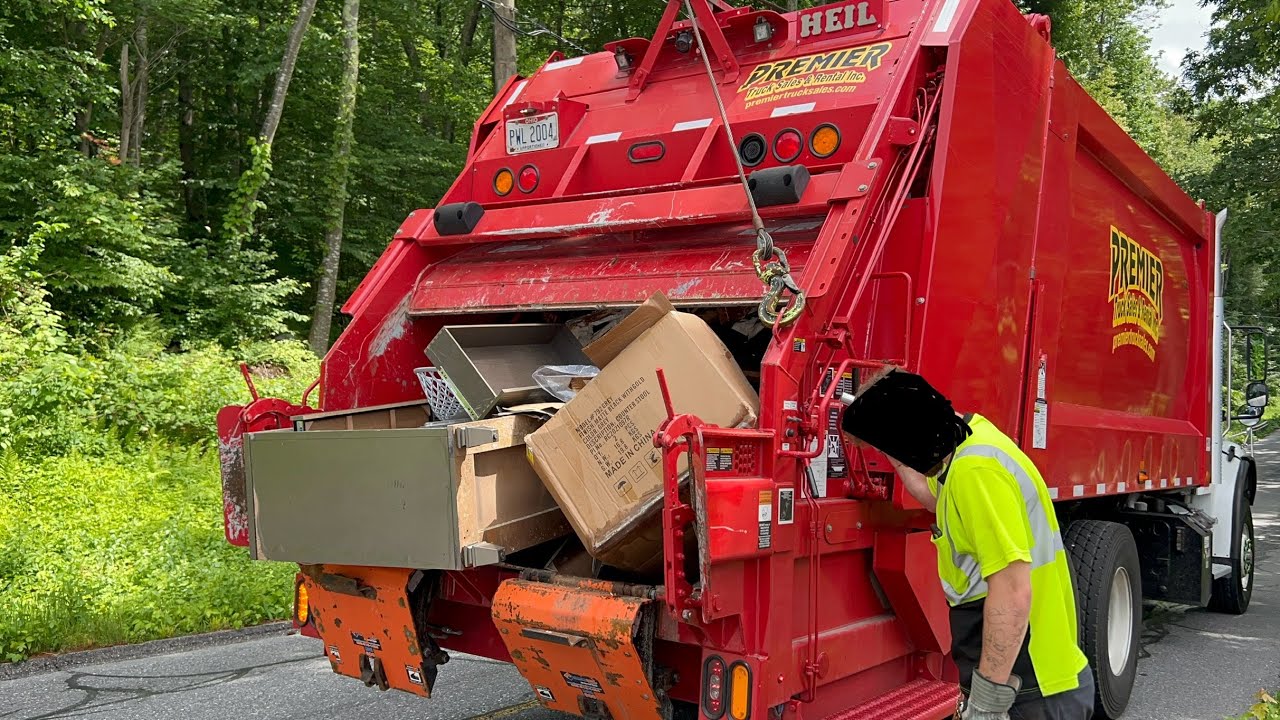 Red Garbage Truck Packing Bulk Waste