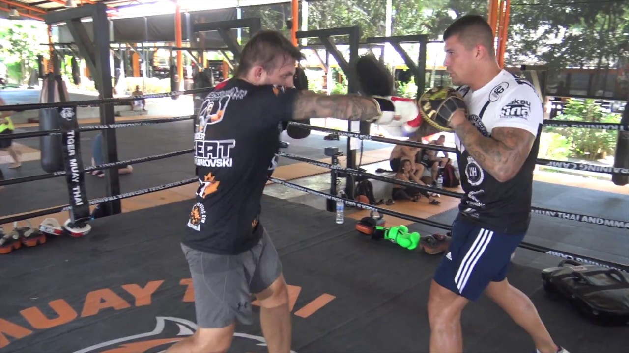 Sam Bastin punching mitts with Jesse Sanchez