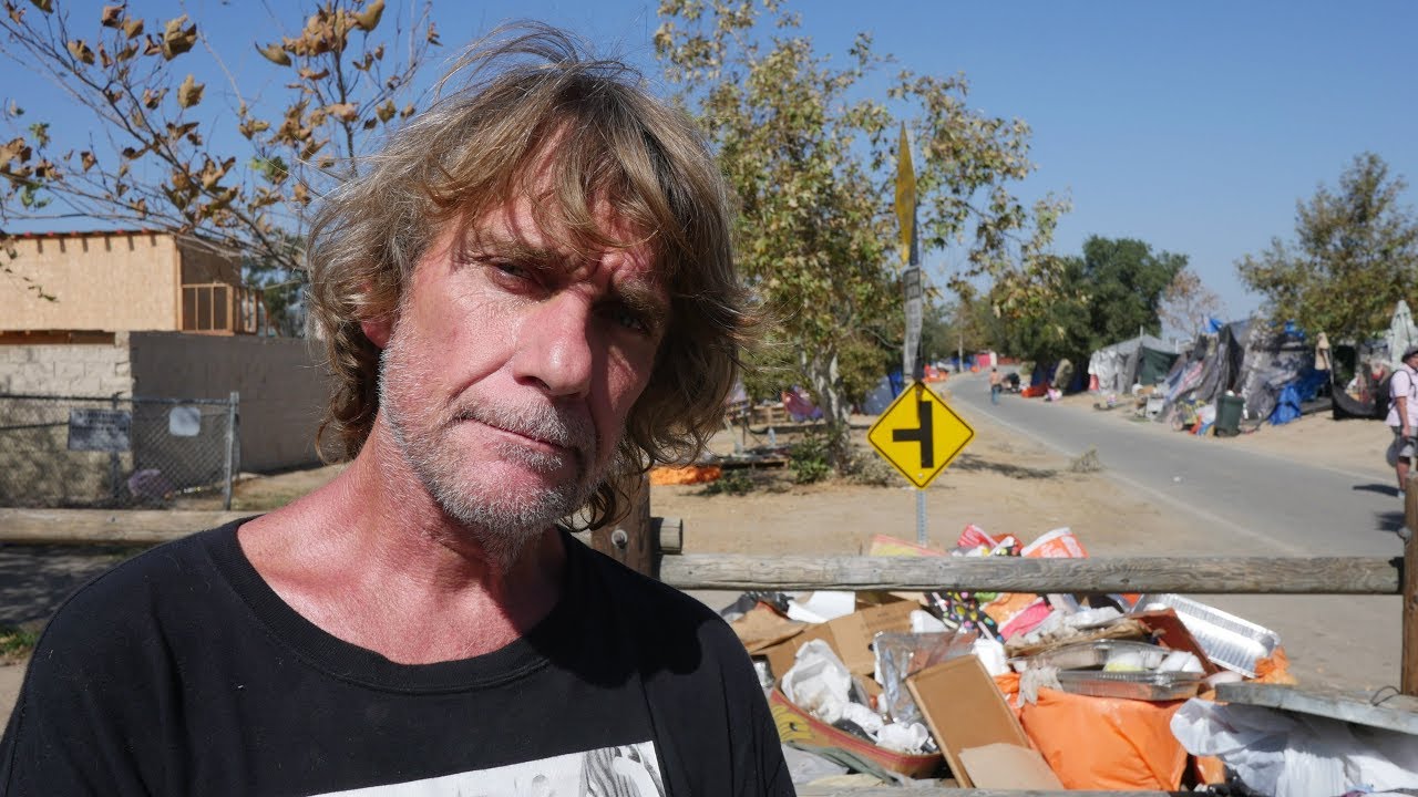 Homeless man calls Orange County’s largest tent city home.
