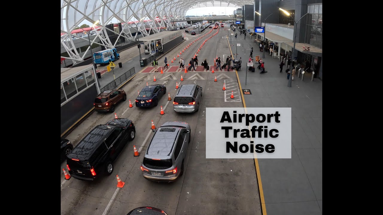 Sound: Airport terminal pick up/drop off area noise. Traffic noise. No talking.