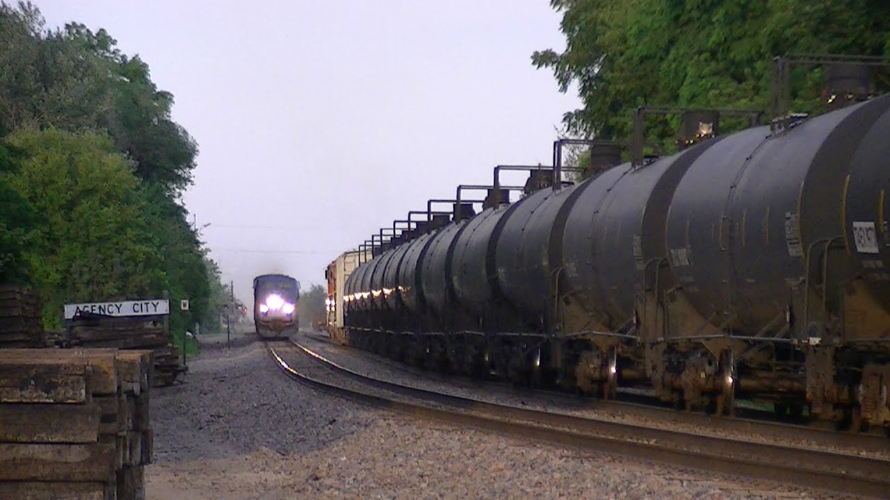 Amtrak with four private cars meets BNSF ethanol train