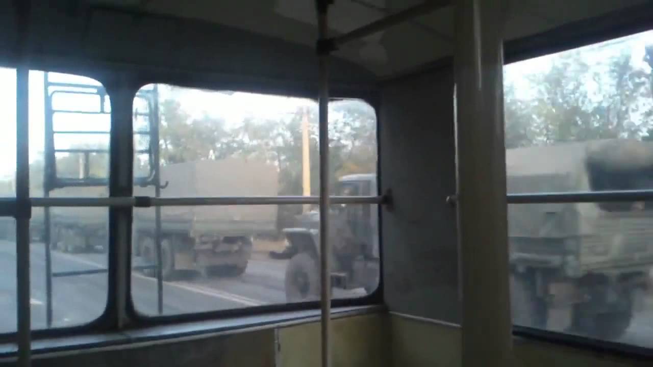 Russian Army in Ukraine. Russian tanks on a road from Lugansk to Russia