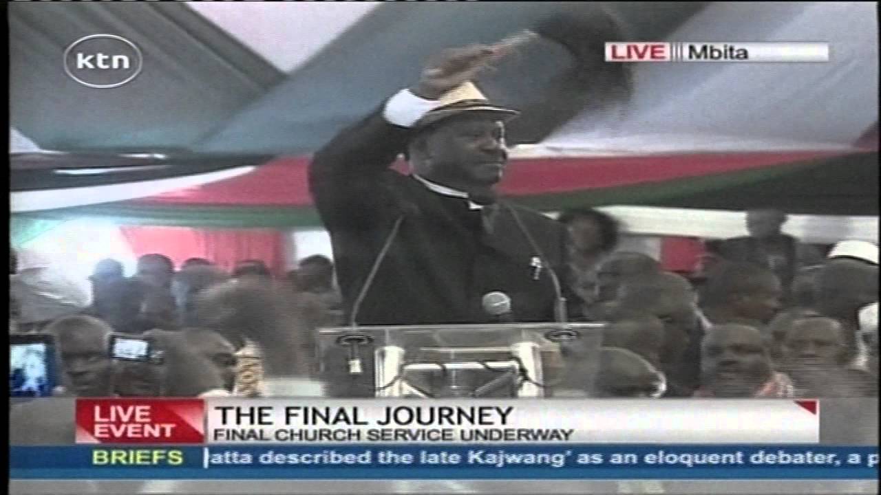 Raila Odinga performs a song to praise the Late Otieno Kajwang