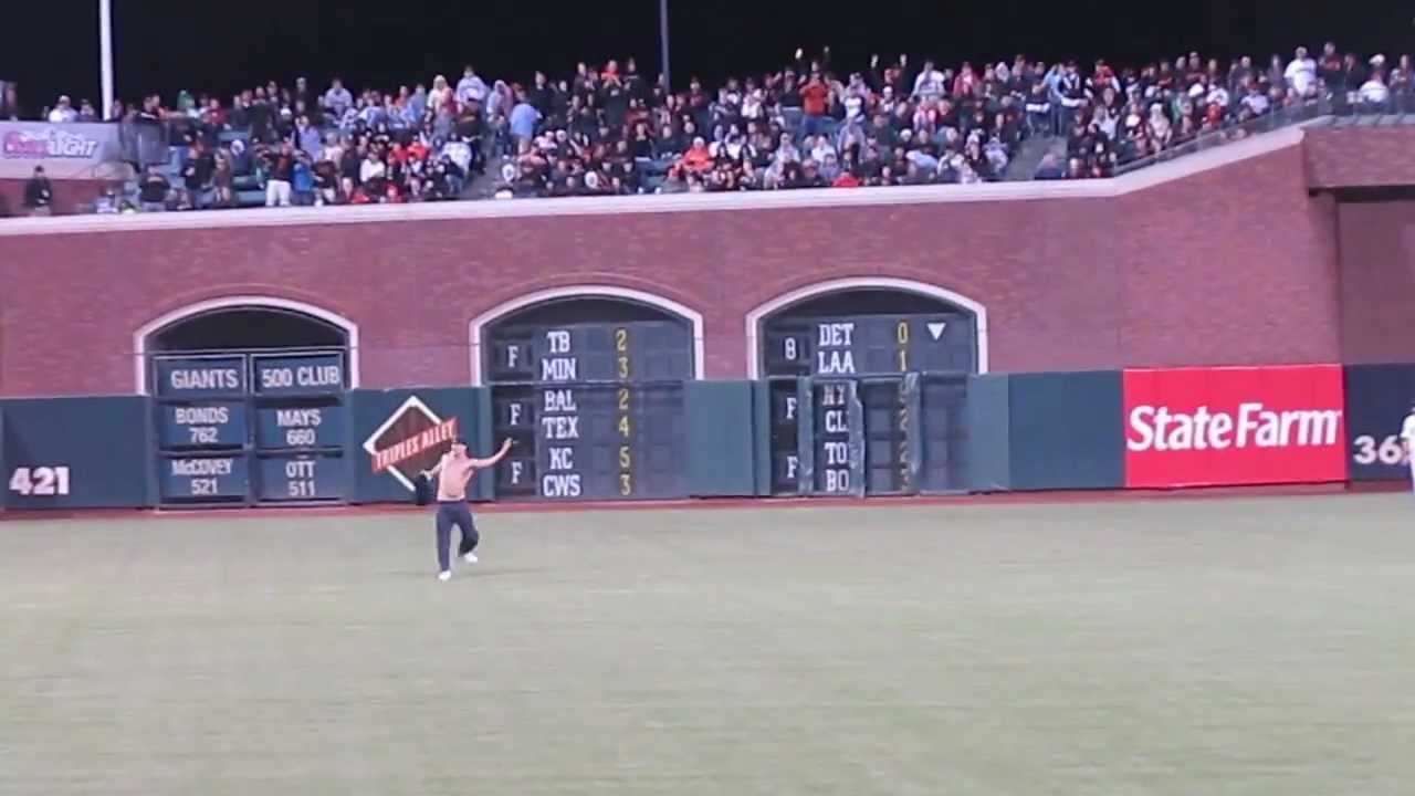 Giants fan runs onto the field!