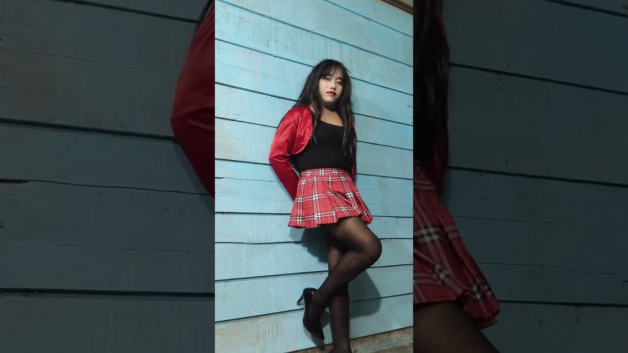 Crossdresser in mini pleated skirt