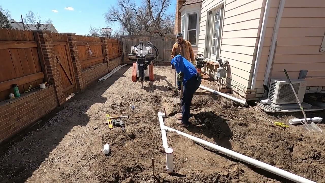 Large concrete stamped patio and regular driveway.