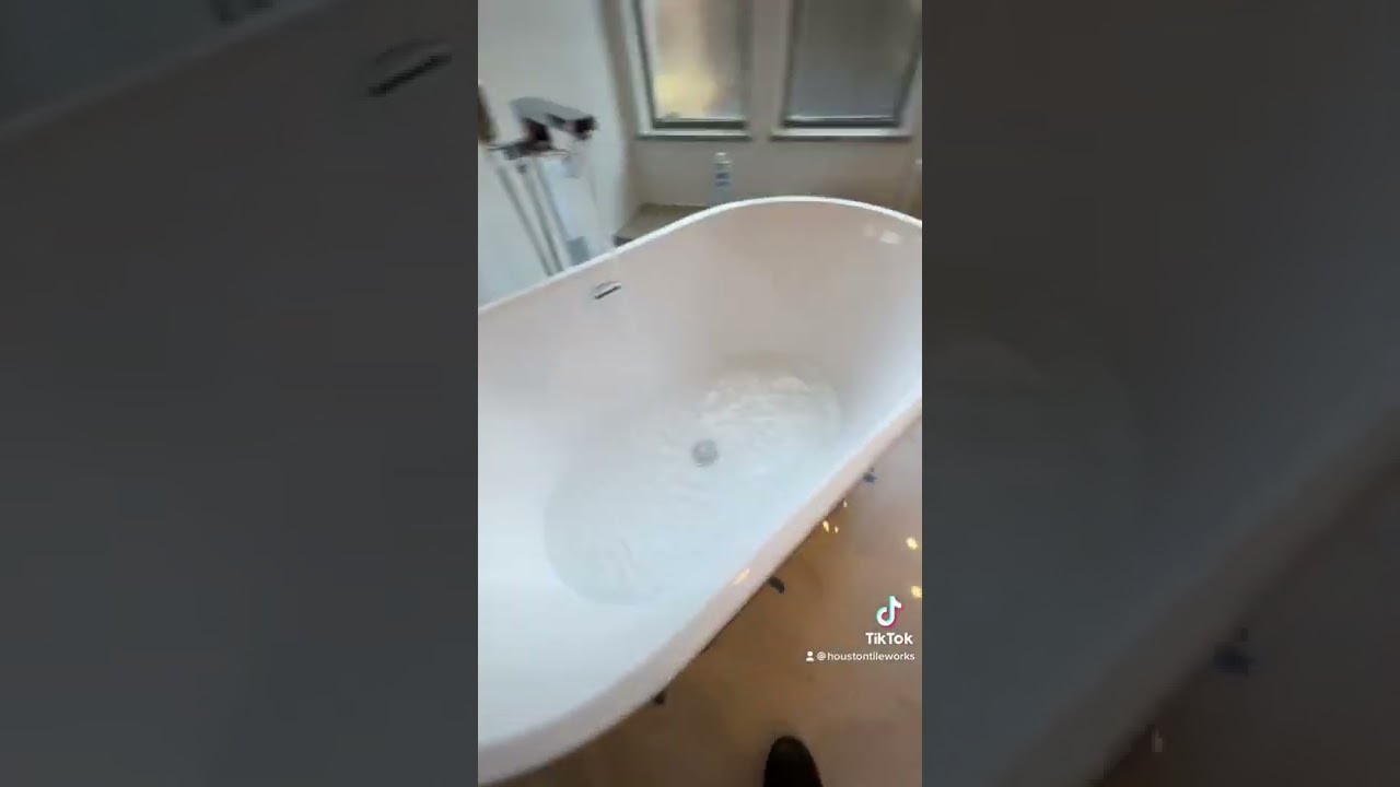 Installation of silicone on a free standing tub tip