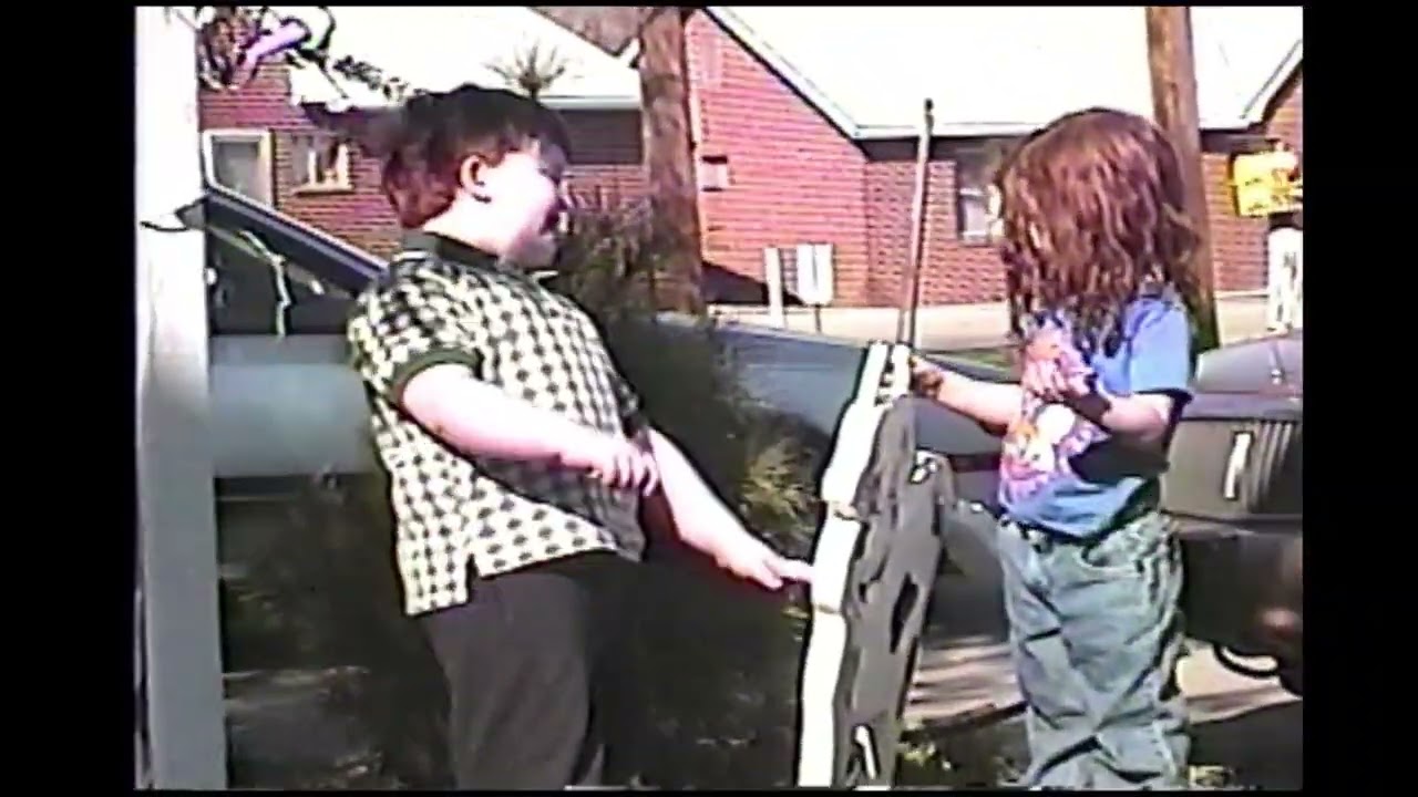 Bryan and Amber playing in yard