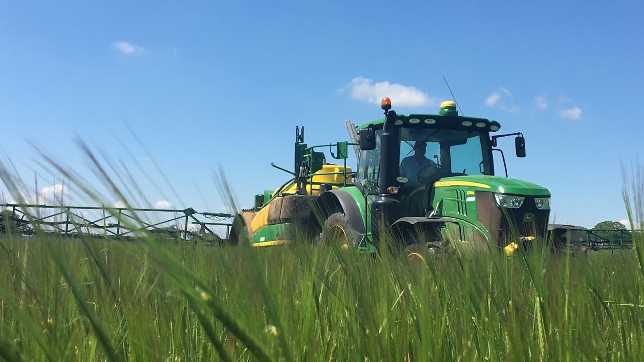 John Deere 6215r on a John Deere  R952i sprayer