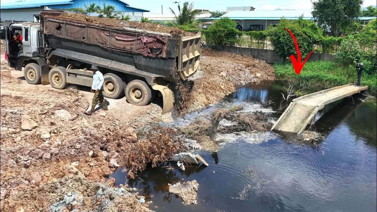 New activity Heavy dump truck unloading stone delete huge pond and bulldozer SHANTUl pushing fill