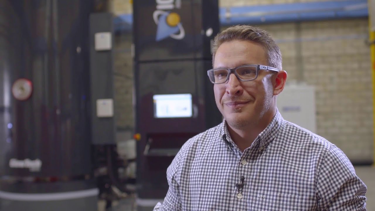 Why is a 'hot wall system' better than a 'cold wall system'?