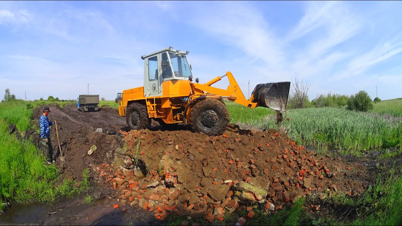 Финал стройки плотины. Задействован ЗИЛ-45065, МТЗ-1221, Т-150К, ТО-30.