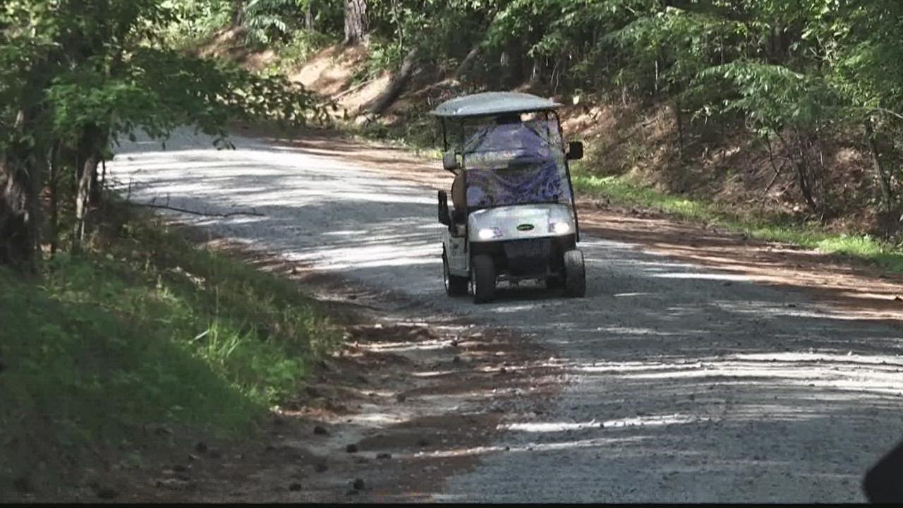 Communities battle on whether to close golf car path