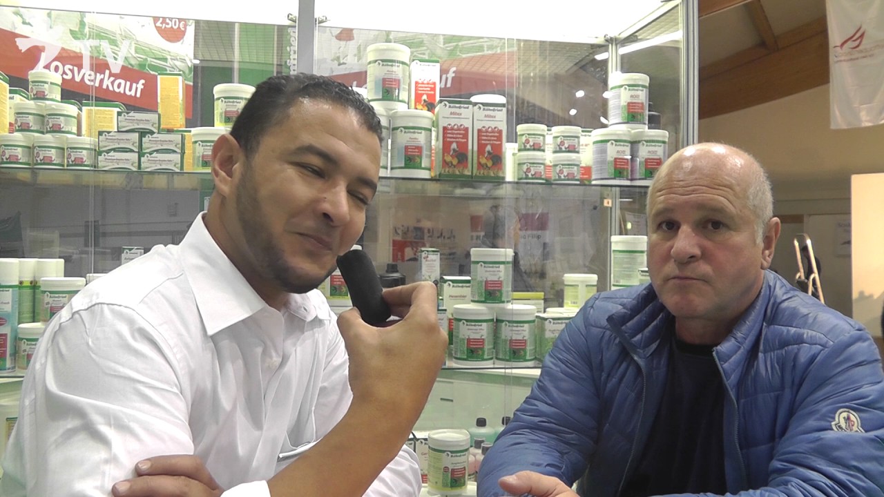 البطل درابا Andreas Drapa  في حوار مع رونفريد Röhnfried في معرض الحمام الزاجل