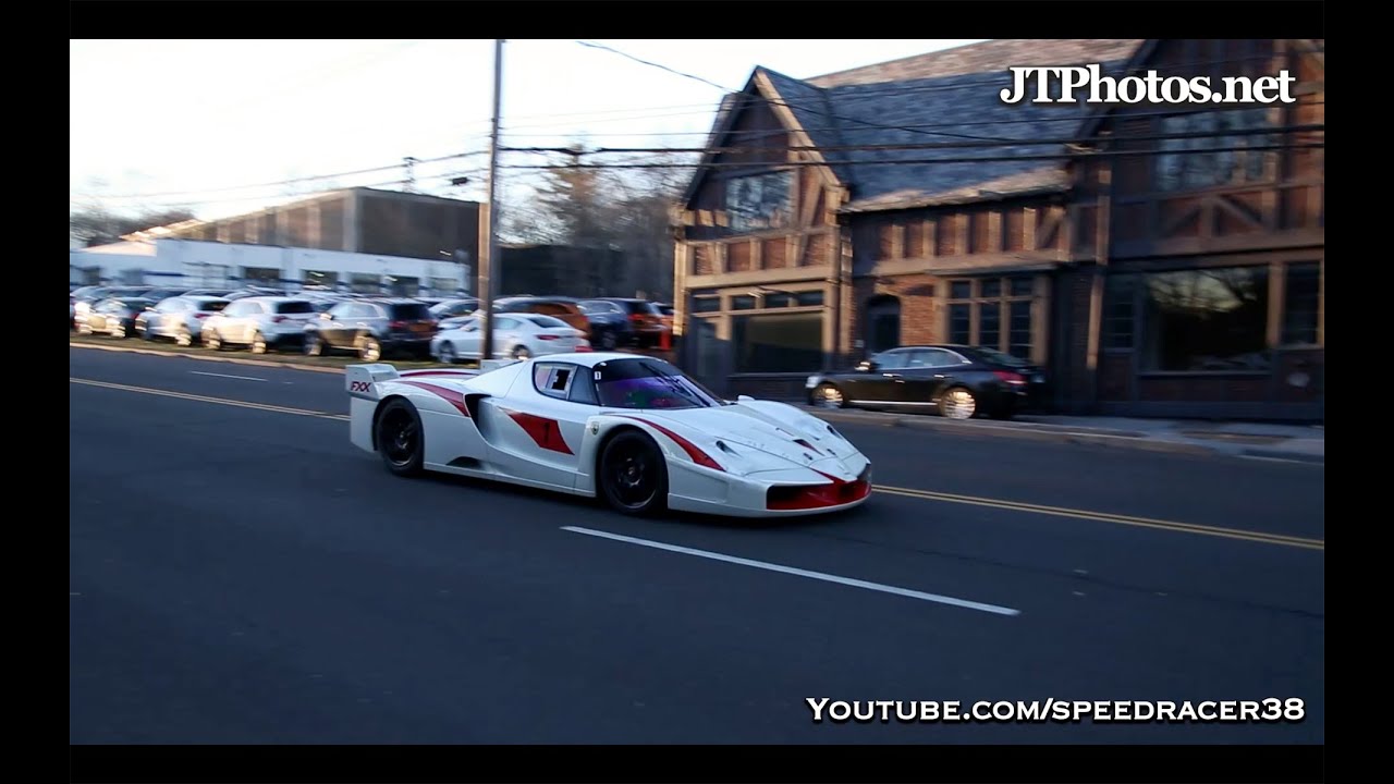 Ferrari FXX EVO driving on a public road
