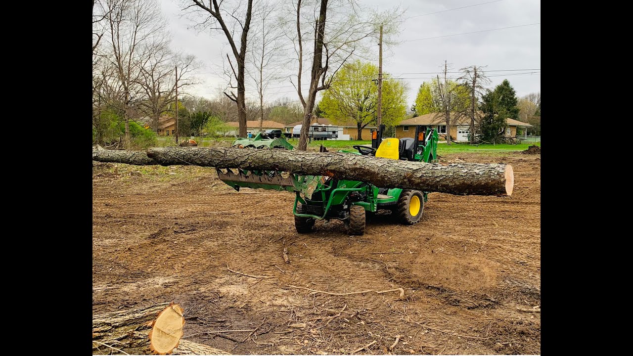 EASY LAND CLEARING WITH THE JOHN DEERE 1025R AND THE FRONTIER AV20F ROOT GRAPPLE