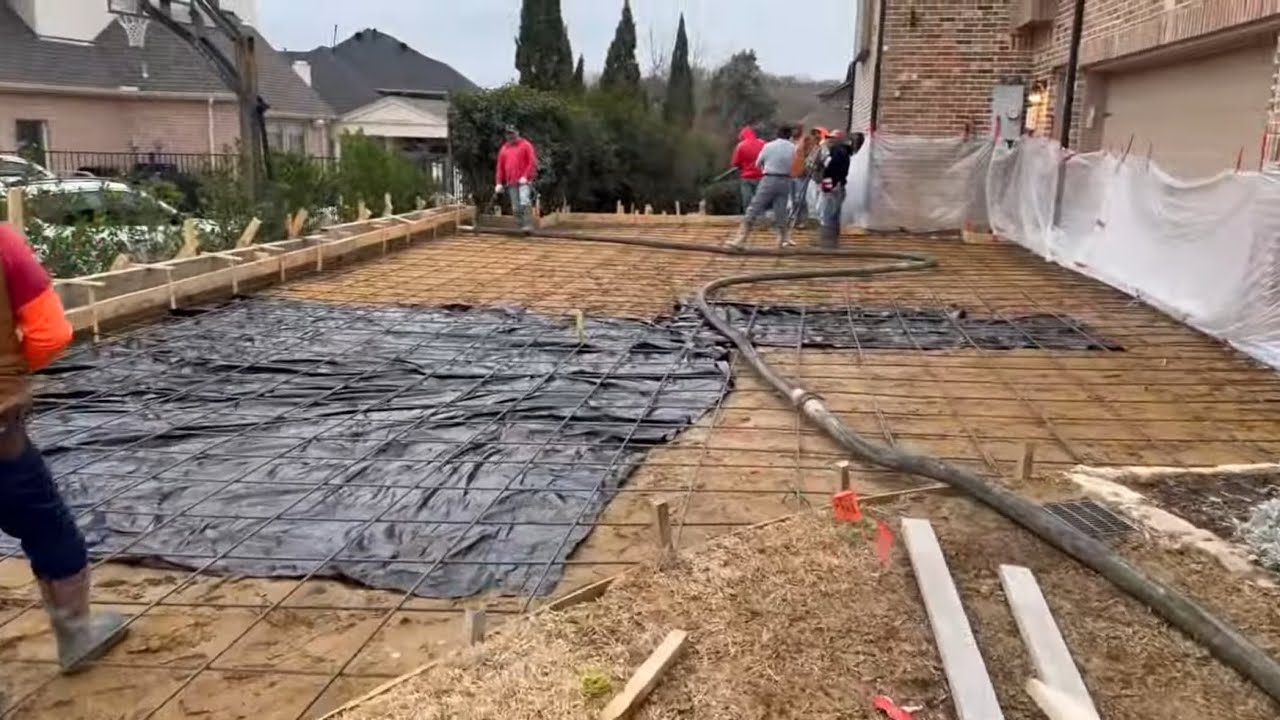 Pumping 40 yards of concrete for this new driveway with Muddyfeet