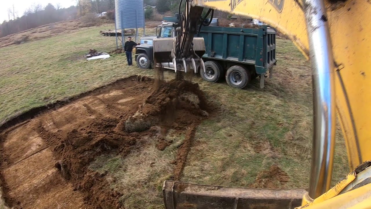 removing top soil for new building site