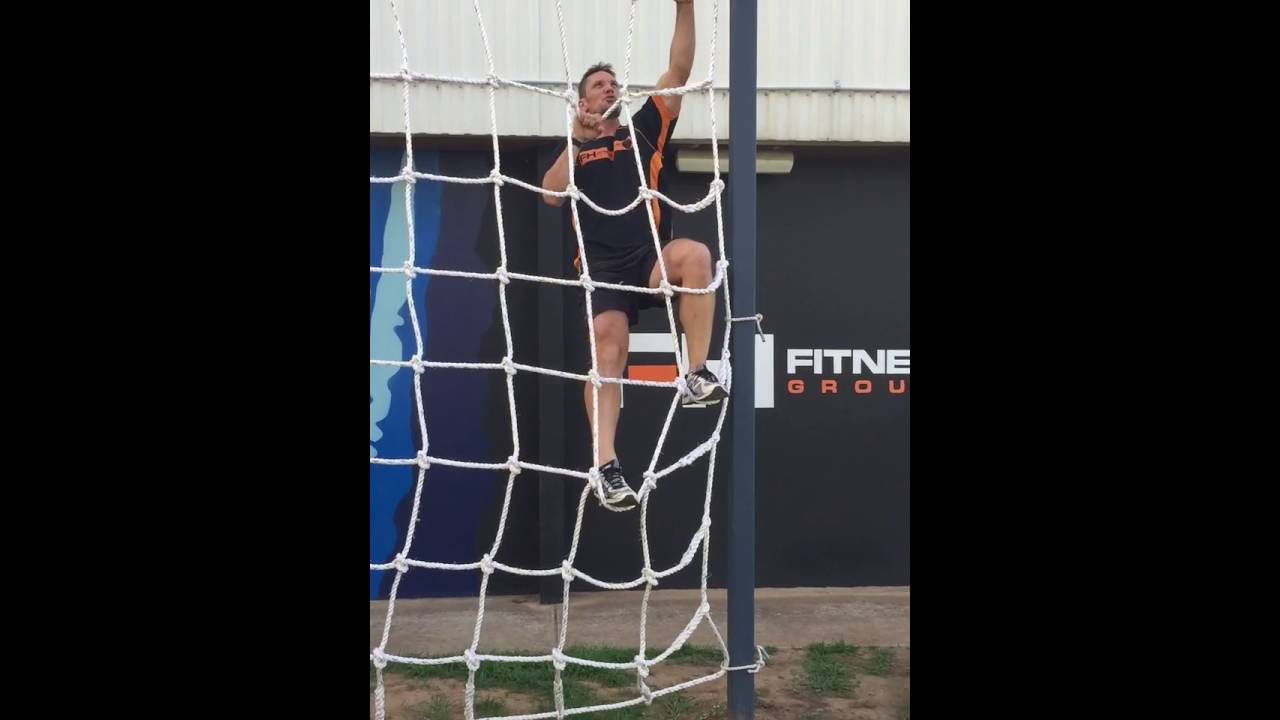 How to climb over a cargo net