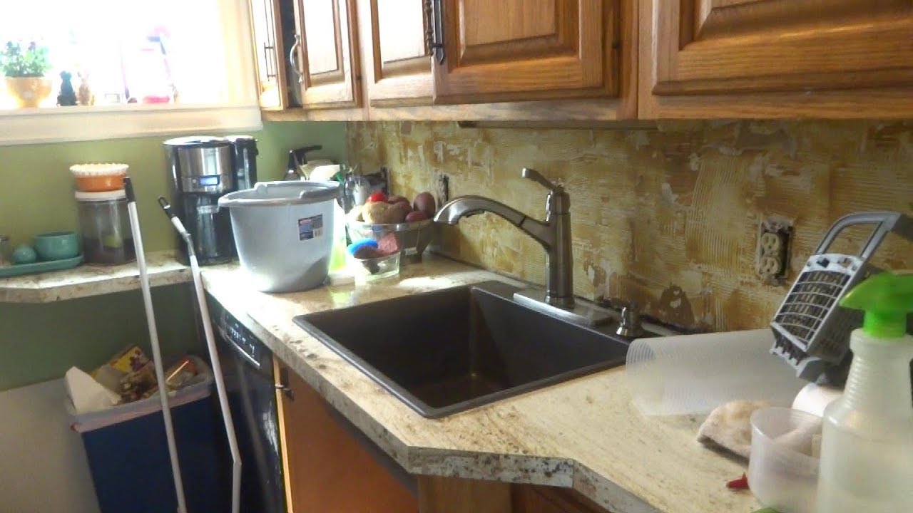 new kitchen sink hooked up and piped off plumbing