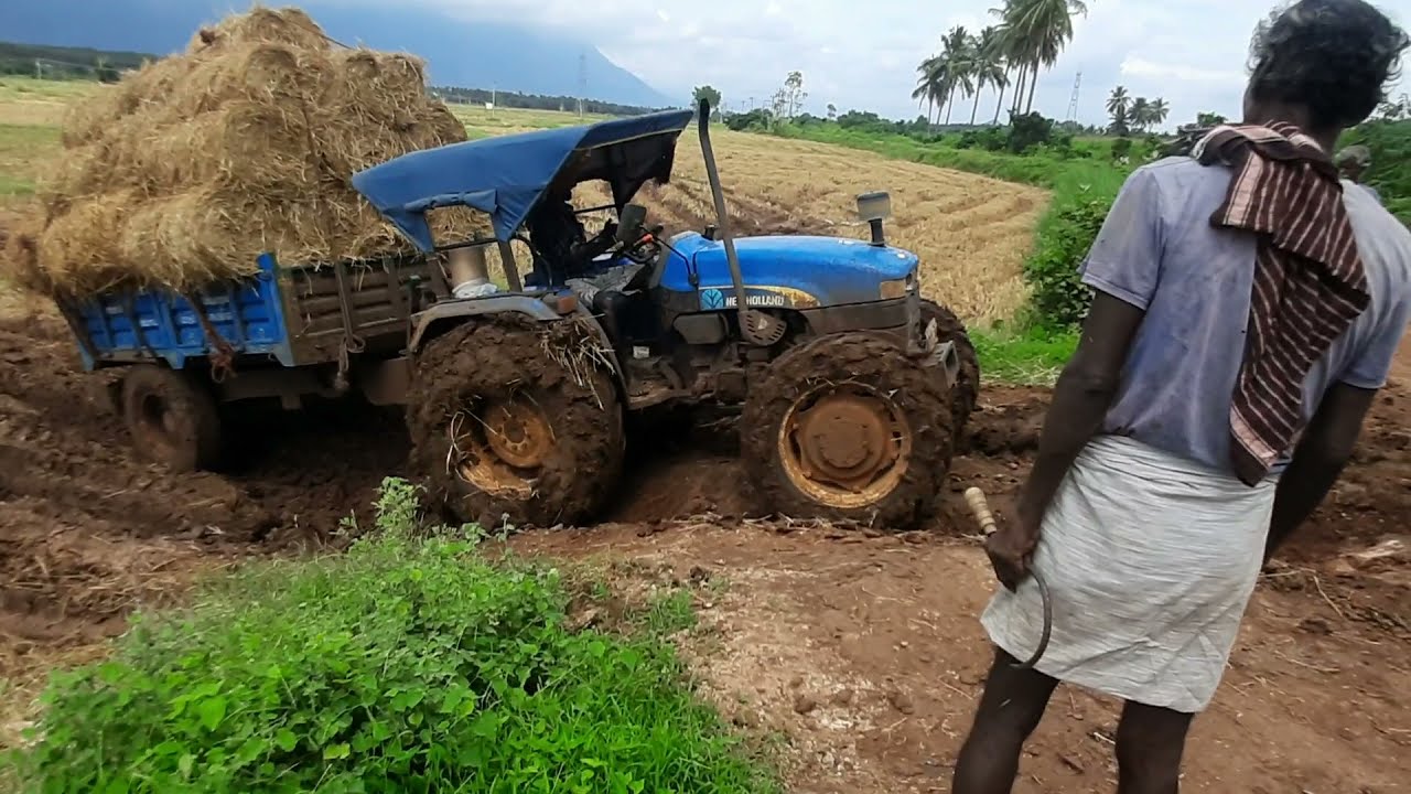 New holland 4710 tractor with loaded taylor stuck in mud farmers life