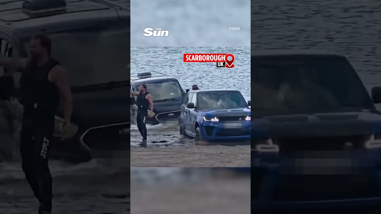 Moment &pound;120k Range Rover is submerged by rising tide after owner gets luxury SUV stuck in sand