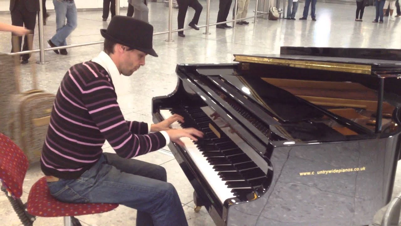 Amazing pianist at Heathrow airport arrivals hall