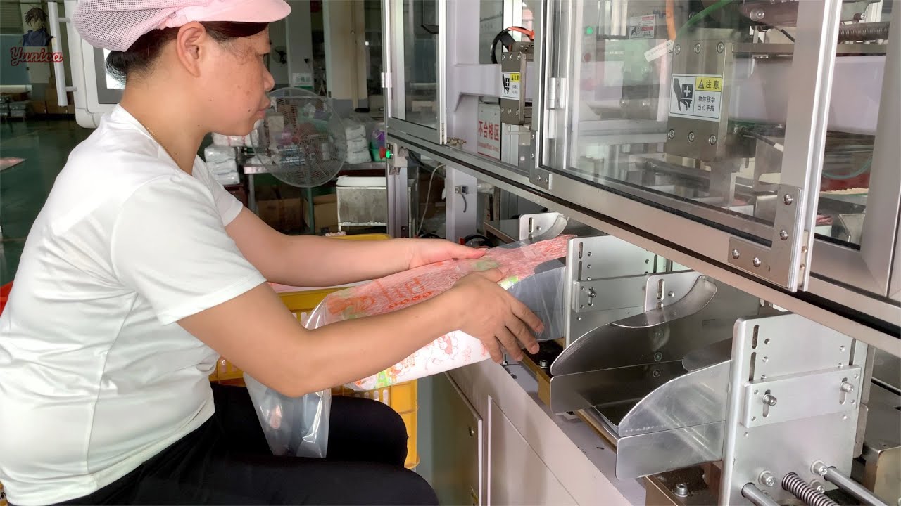 Automated high speed mass production process of baby diapers. Diaper factories
