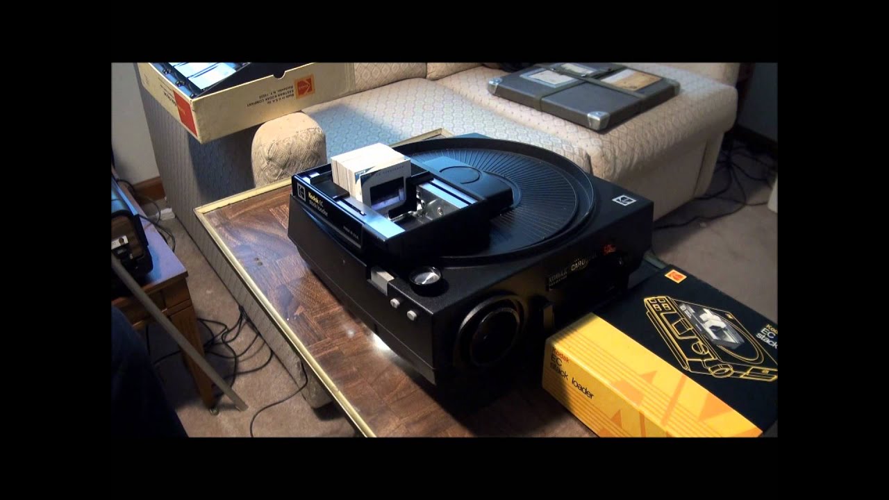 Использование устройства для загрузки фотокопий Kodak и зажимов для слайдов.