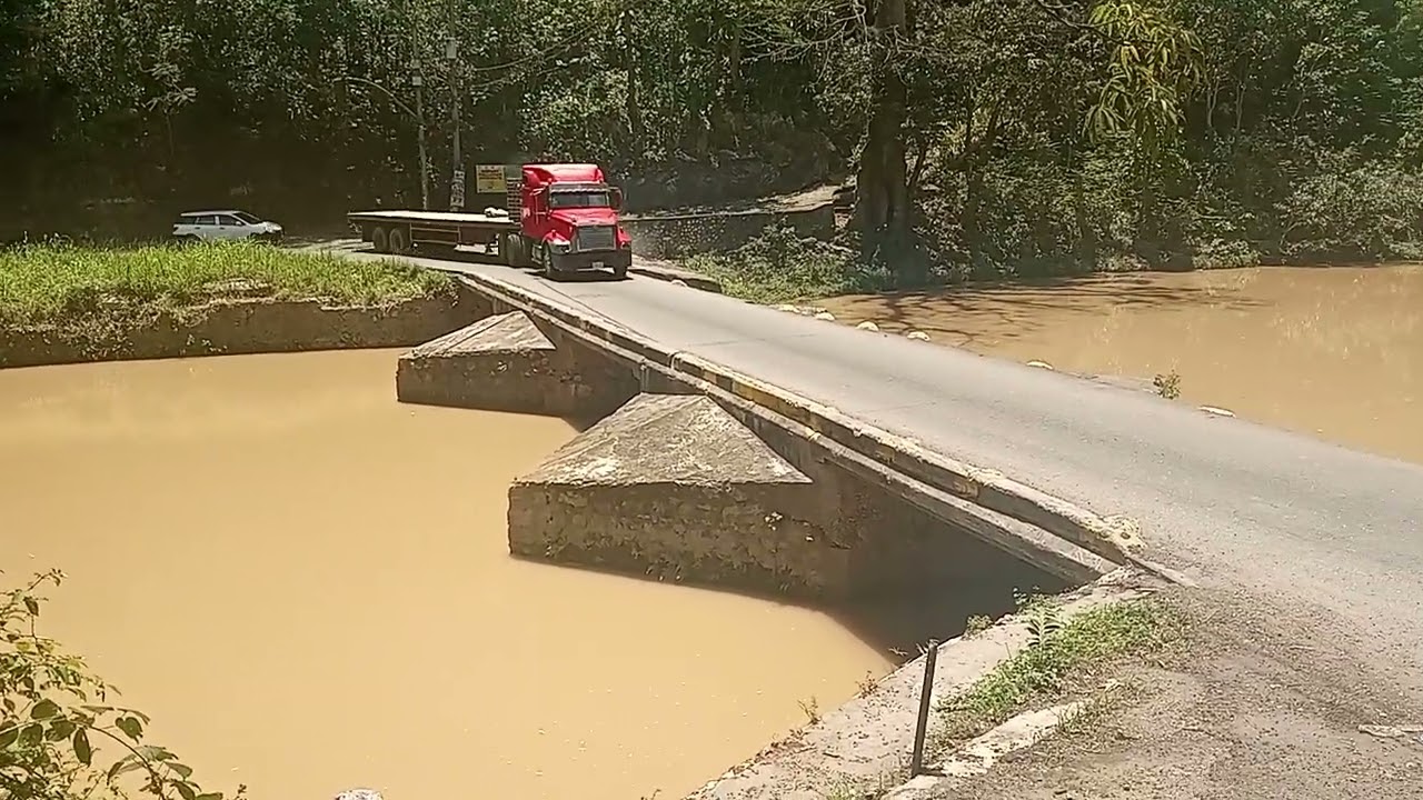 Trucks going across the most dangerous bridge in Jamaica #flatbridge