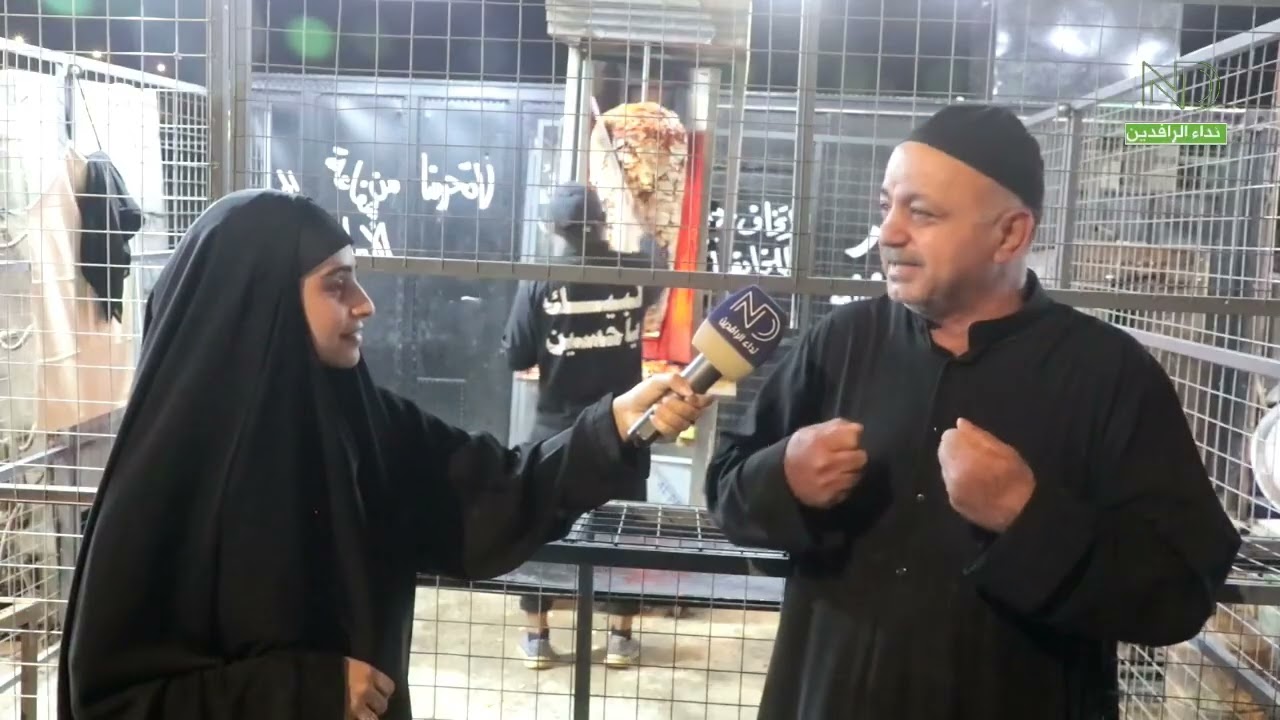 بكاء الزائرين وخدام المواكب الحسينيه عند ذكر الامام الحسين ( ع) أثناء المسير وتقديم الخدمات لزائرين 