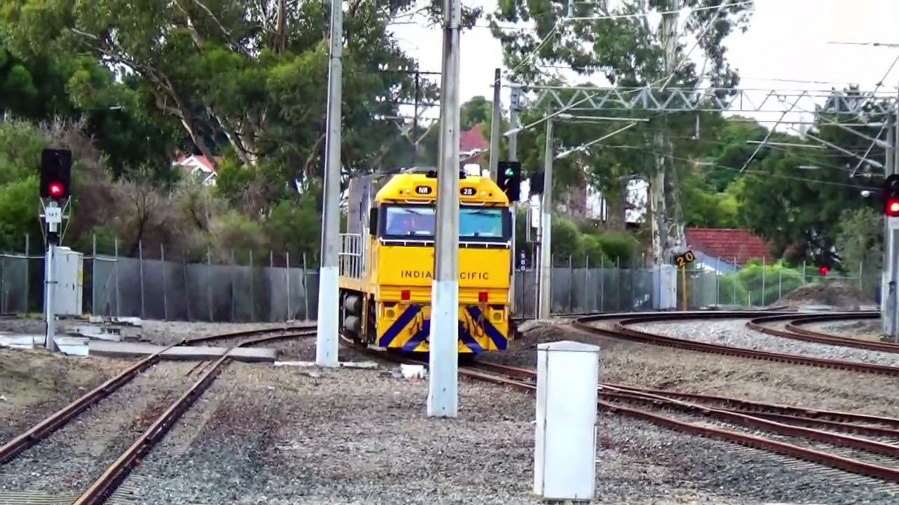 A freshly repainted NR 28 is arriving at EAST PERTH Terminal with the Indian Pacific passenger train