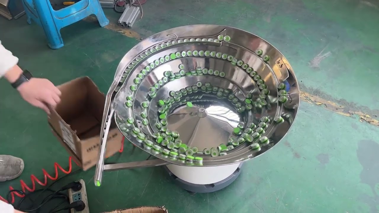 Spout vibratory feeder # cap feeding machine