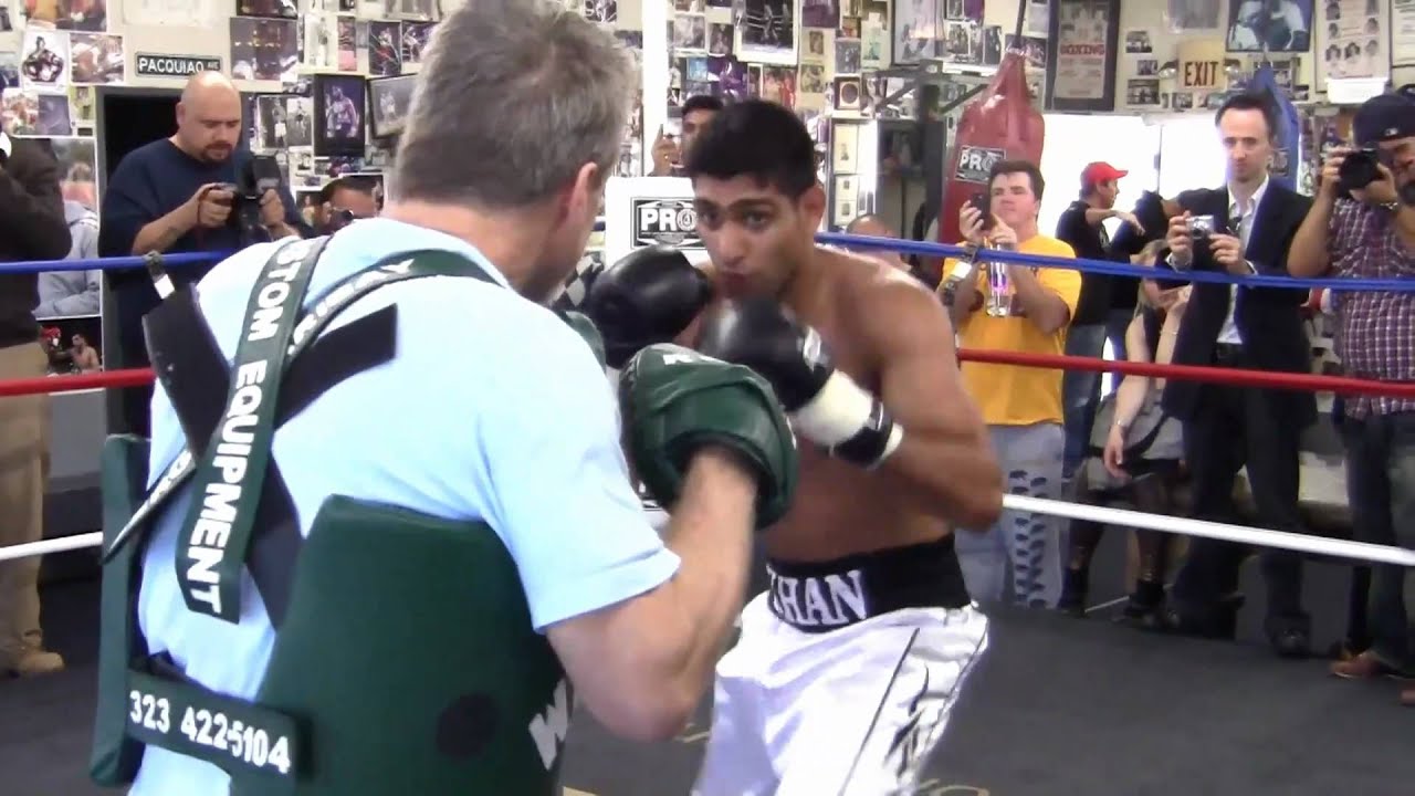 Amir Khan on the mitts with Freddie Roach