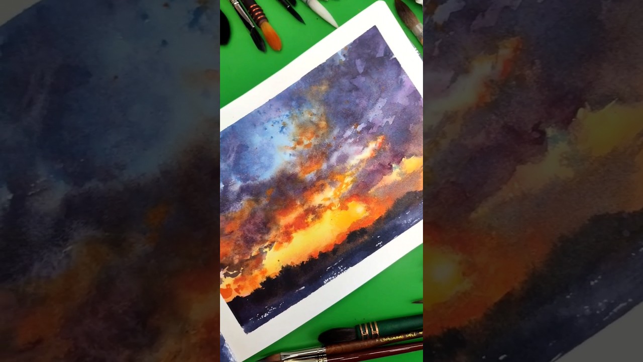 My sketchbook filled with watercolor skies - painting a sunset! 🎨🖌️🤩 #shortsvideo #watercolorart