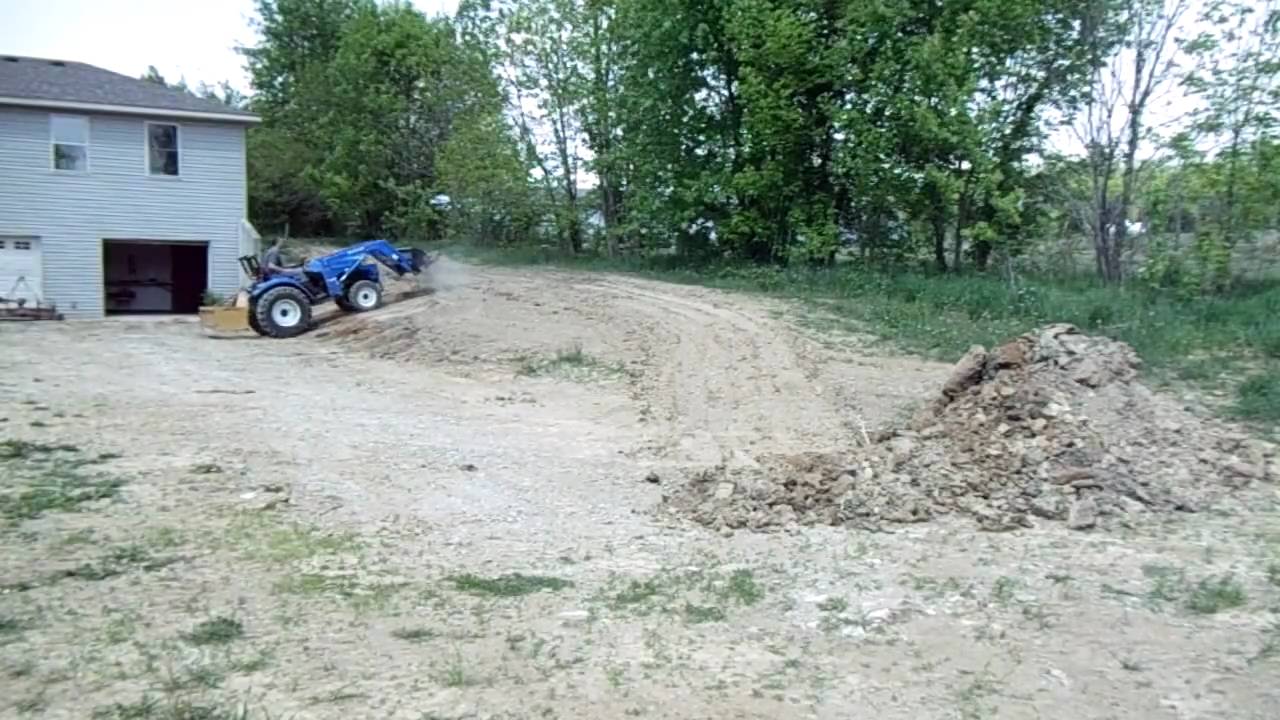Grading Dirt with New Holland Tractor Using Box Blade and Loader