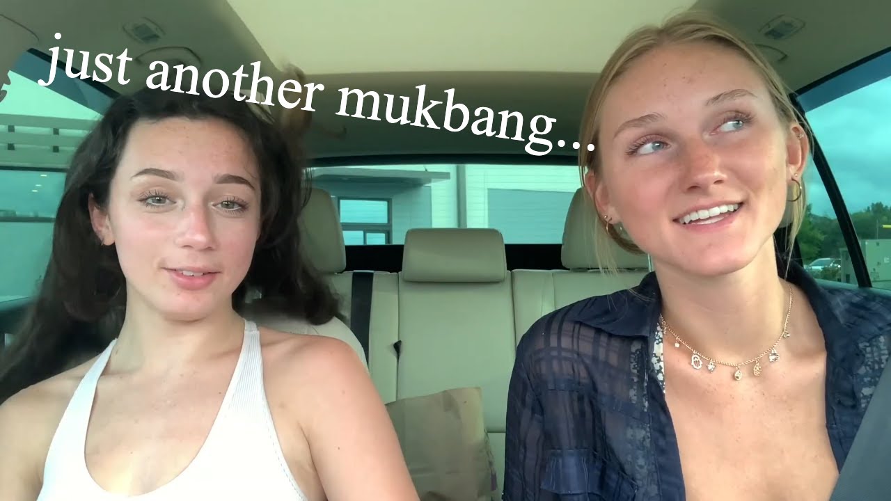 two girls eating in a car