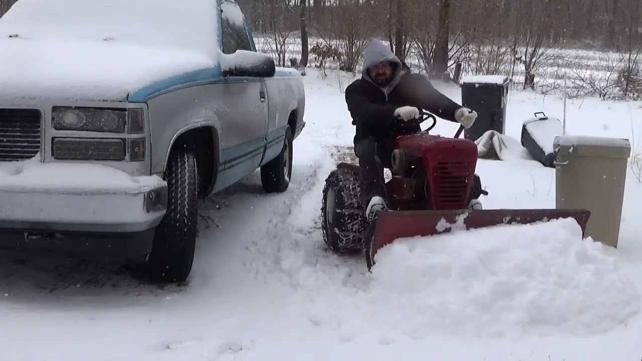 1963 wheel horse 753 pushing a little snow (vibration later in video was hood against muffler pipe)