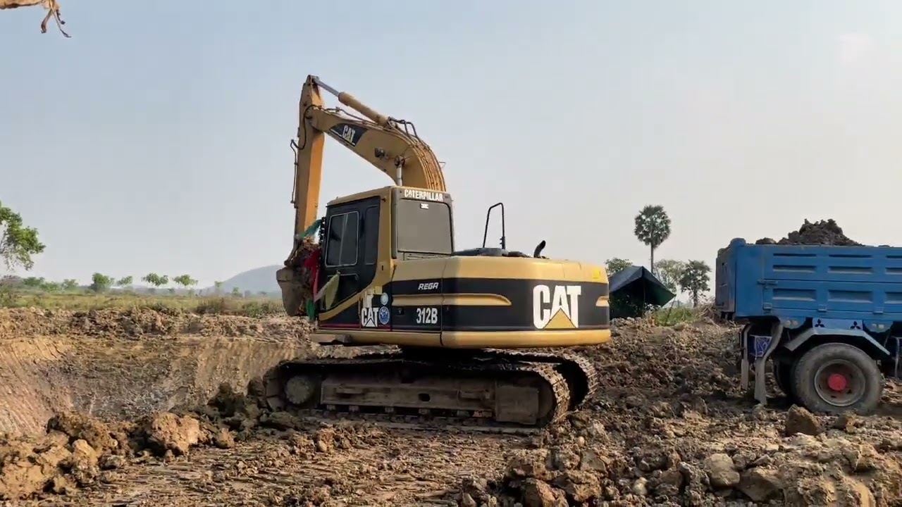 Omg digging action Excavations with Truck 3 a huge excavator in a field