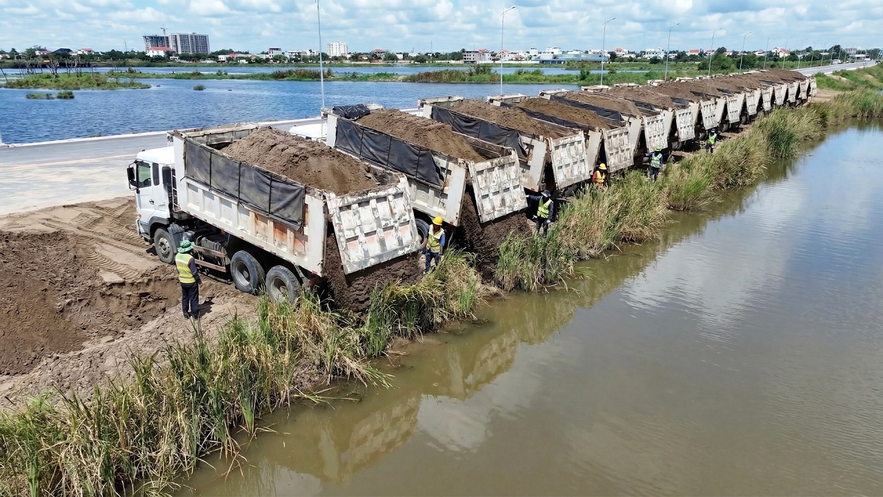 Big Sandy Filling Project Operation Bulldozer Pushing Sand Vs Dump Truck Unloading Sand