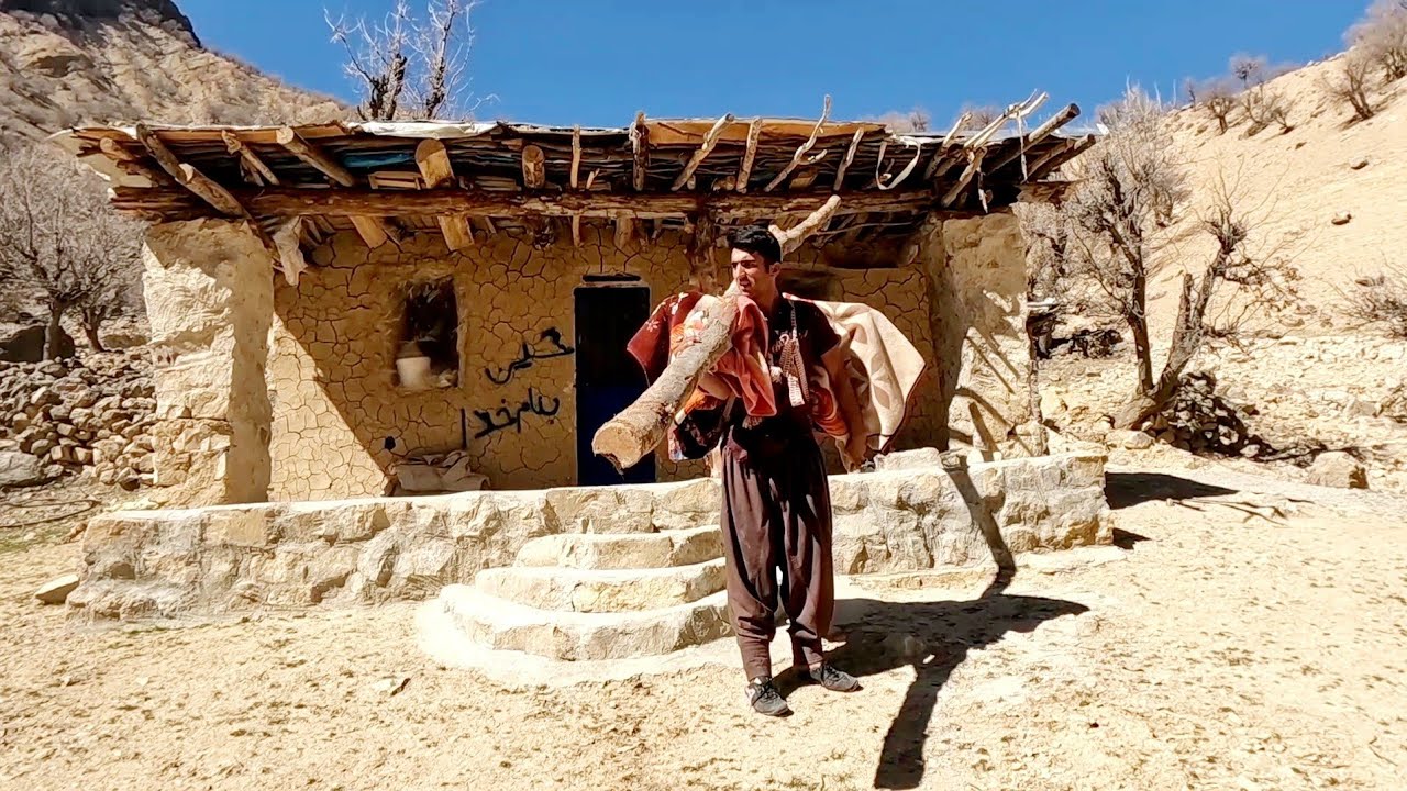 Nomadic challenges: hard nomadic life and covering the head of the hut in the mountain