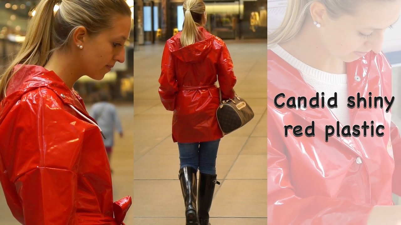 Rainwear girl in red plastic raincoat