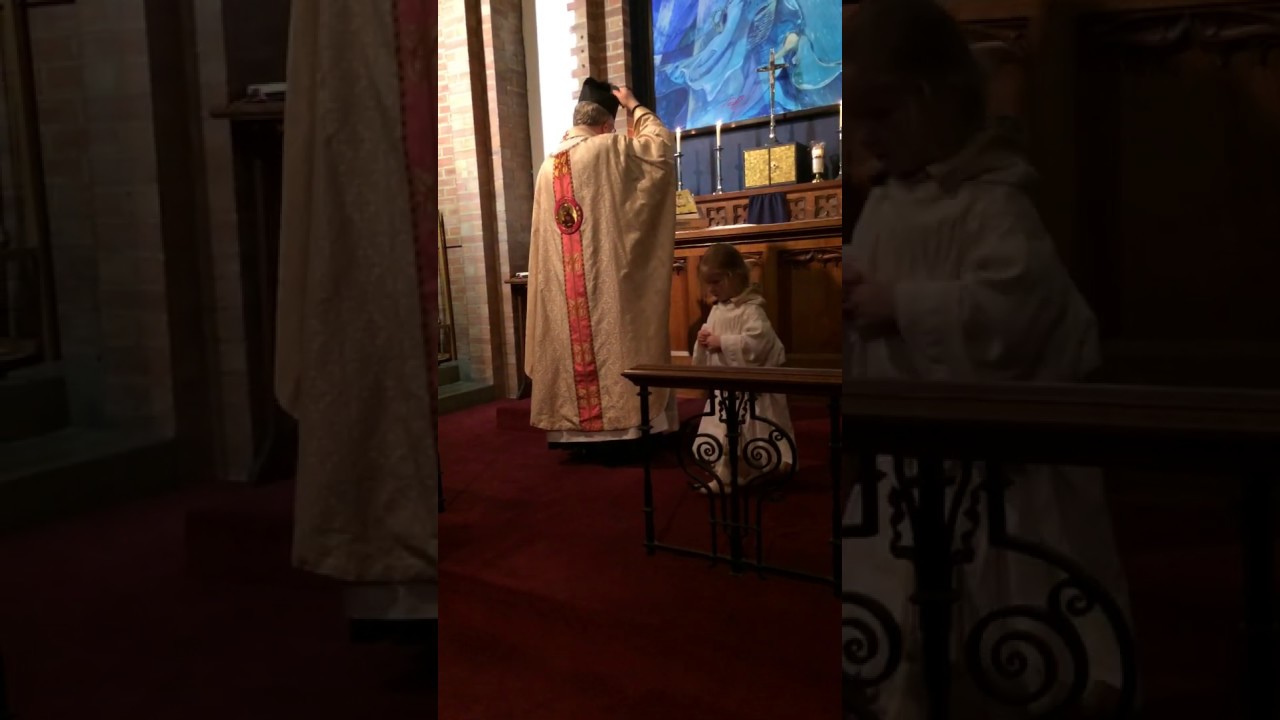 Low Mass with junior altar server.
