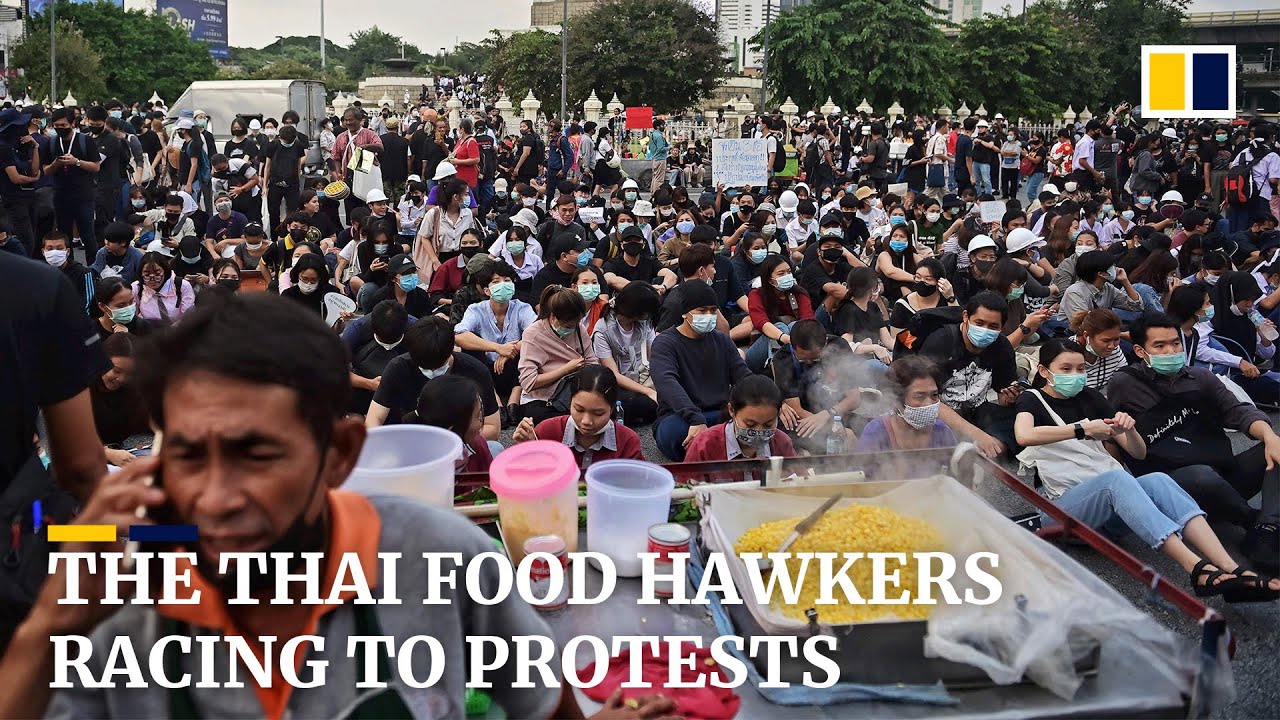 The Thai hawkers arriving at protests before demonstrators and police
