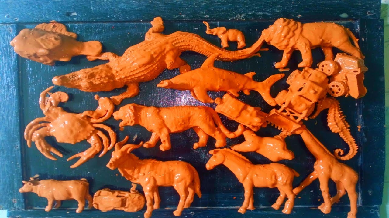 cleaning muddy animal toys,lion, cow, tiger,crocodile, zebra, goat, giraffe, elephant, sea horse