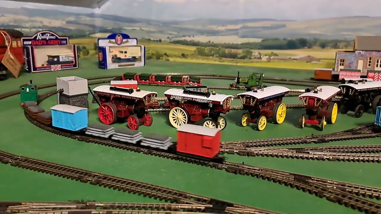 Bachmann Peter Sam pulling 3 brown 3 grey slate wagons, blue box van and red brakvan 