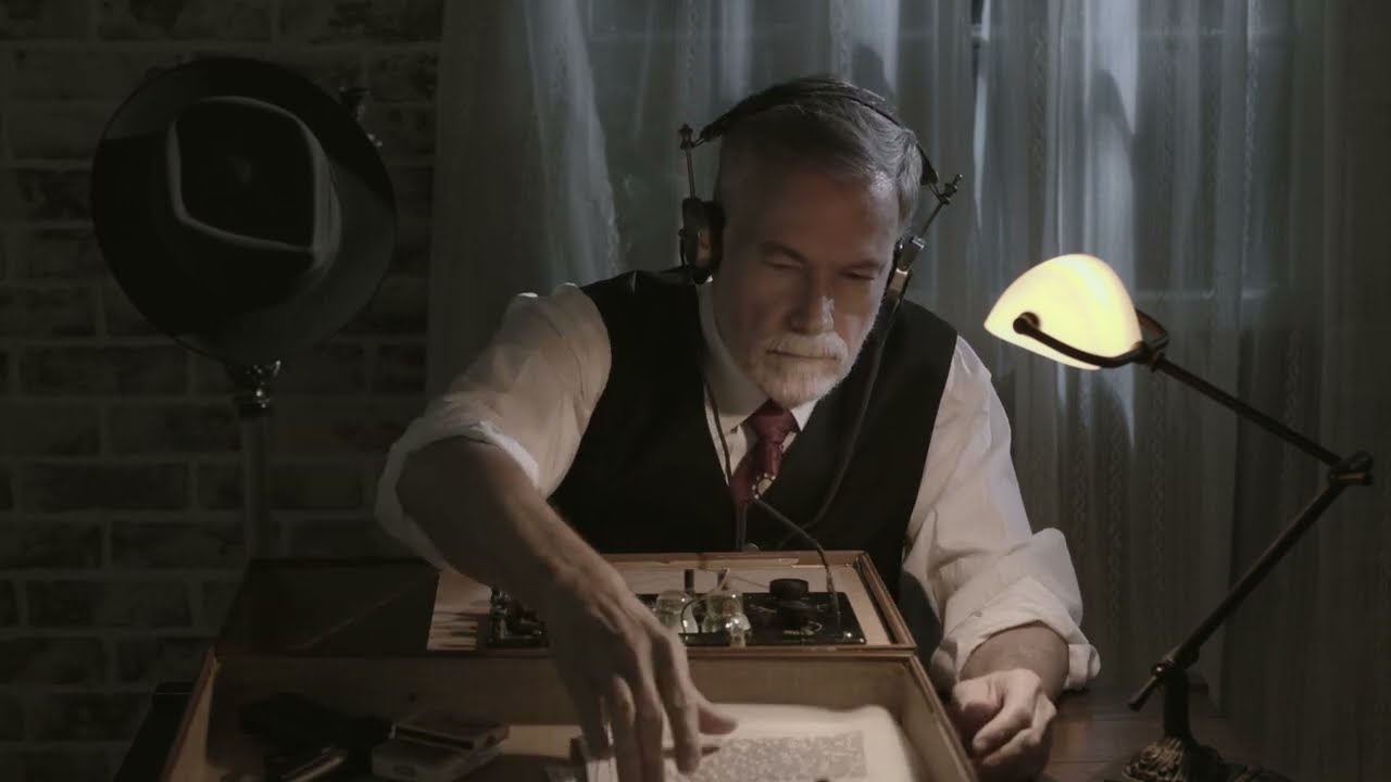 ASMR WWII spy opens a suitcase to reveal a wireless transmitter which he uses to transmit intel.