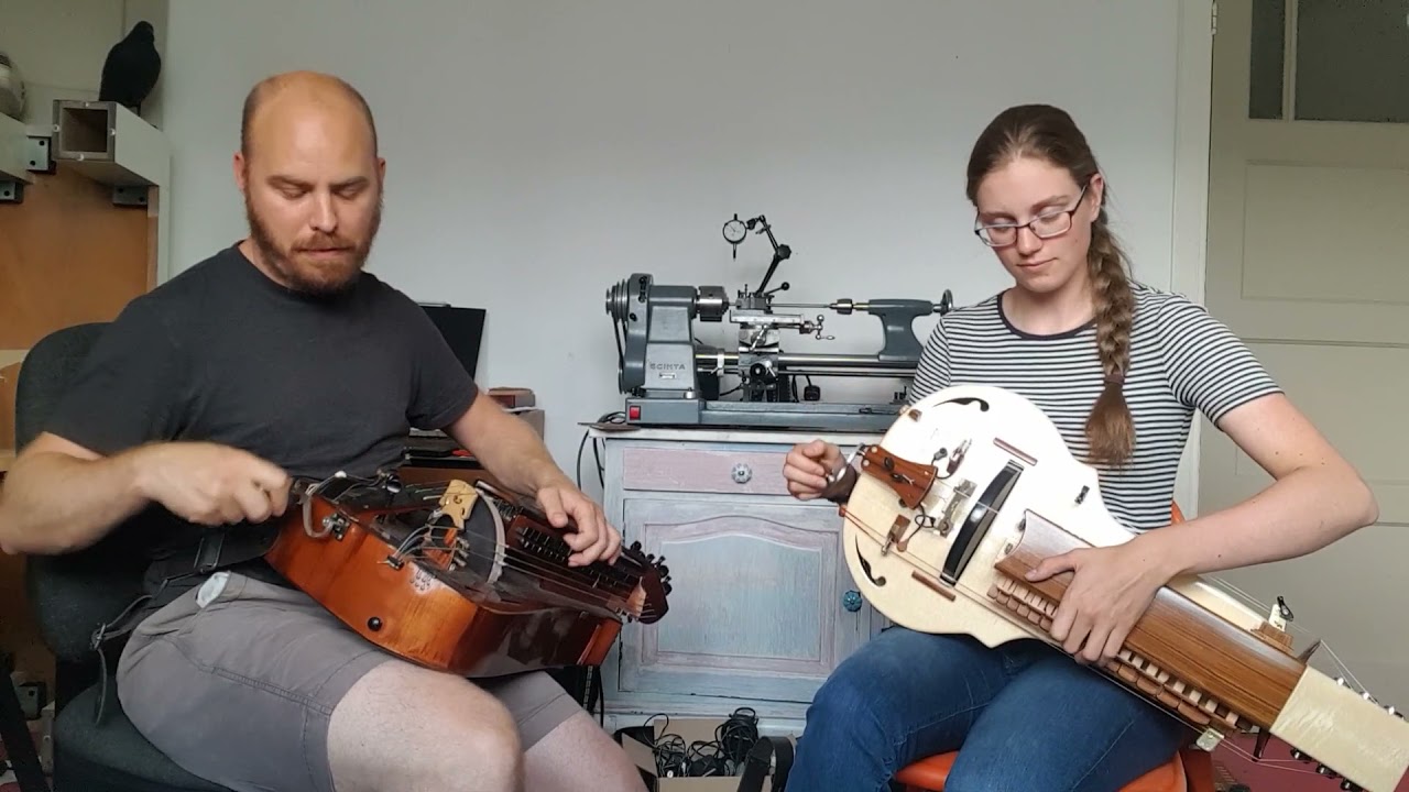 Laura and Jimi playing a hurdy gurdy tune