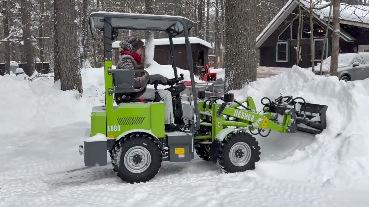 Plowing huge snow with Nesher L880 electric loader