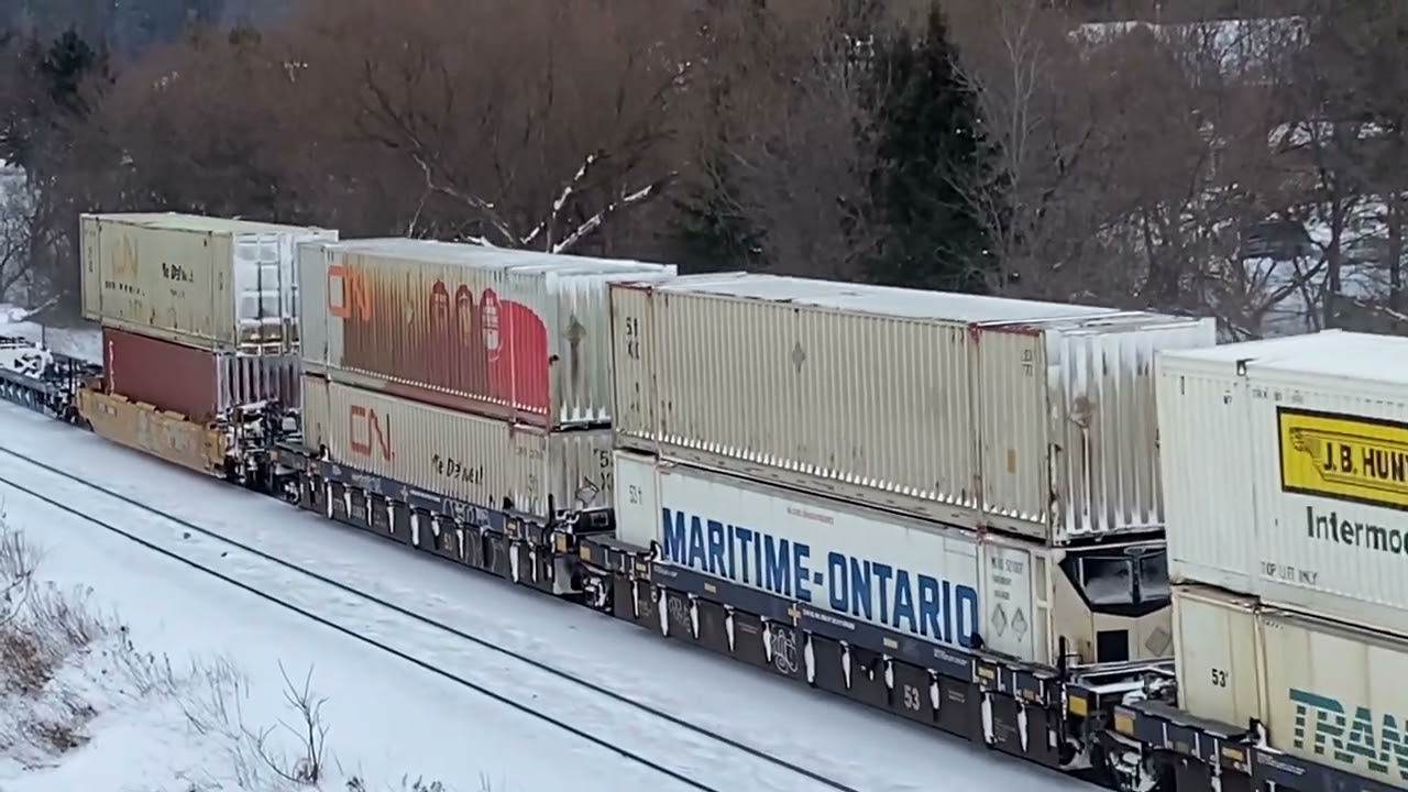 CN Q105 lead by 2903 with a Mid DPU 8333 in Richmond Hill ON